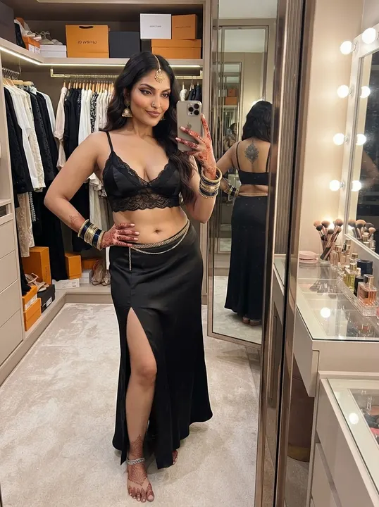 AI image: A mirror selfie in a walk-in closet, black lace top and long skirt