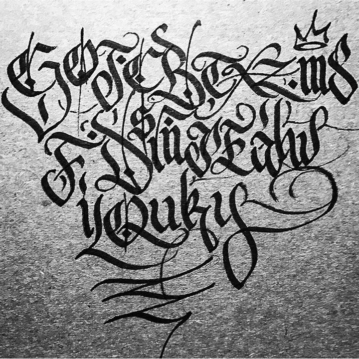 Black blackletter letters and flourishes on grey textured paper, under a small crown