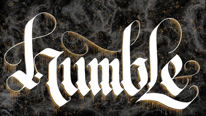 The word Humble in white blackletter with gold flourishes, on black