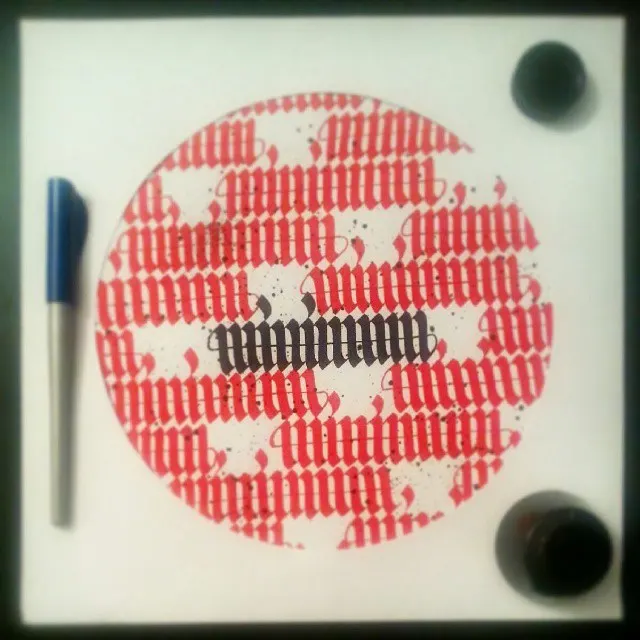 A ring of red lettering around the word minimum, with ink pots and a pen
