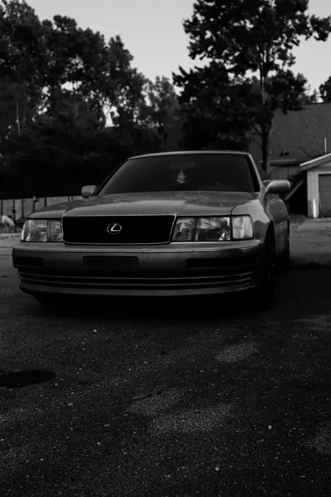 A Lexus at dusk, in black and white