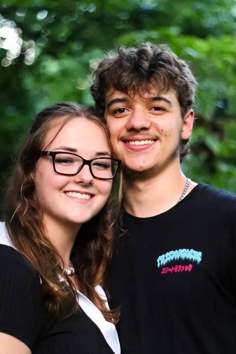 A young couple smiling close together