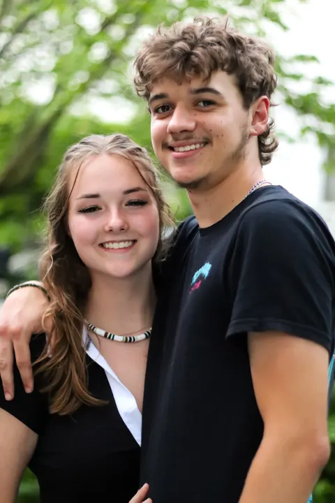 A young couple arm in arm