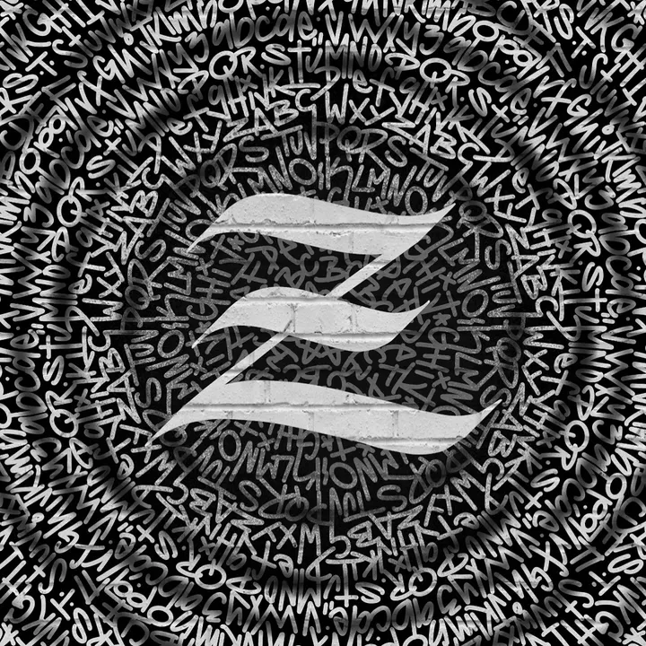 A silver Z over a field of tiny hand-cut lettering